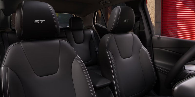 Leatherette seats with perforated inserts and Santorini Blue accents